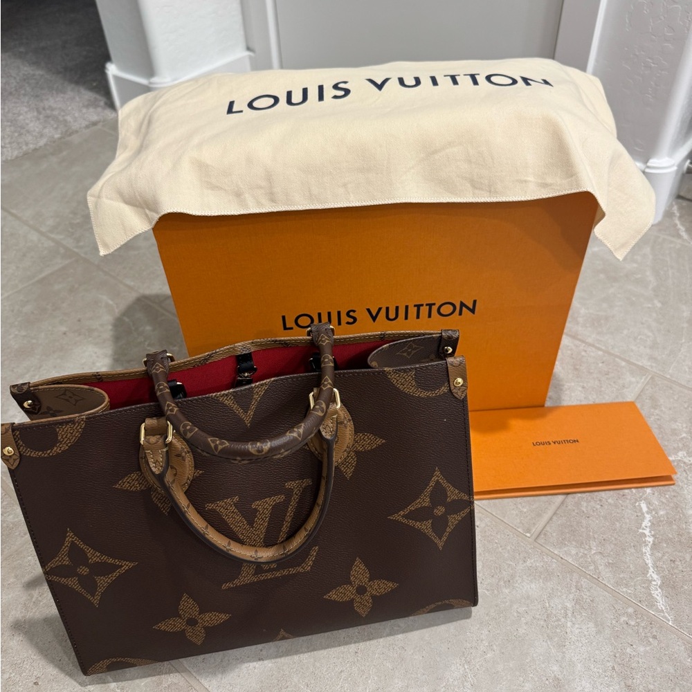Louis Vuitton Brown Monogram Handbag with Red Interior